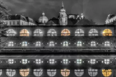 The market halls in Ljubljana are reflected in the Ljubljanica