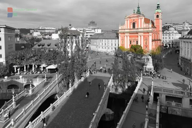 Ljubljana's "Three Bridges" with the red Franciscan Church "Annunciation"